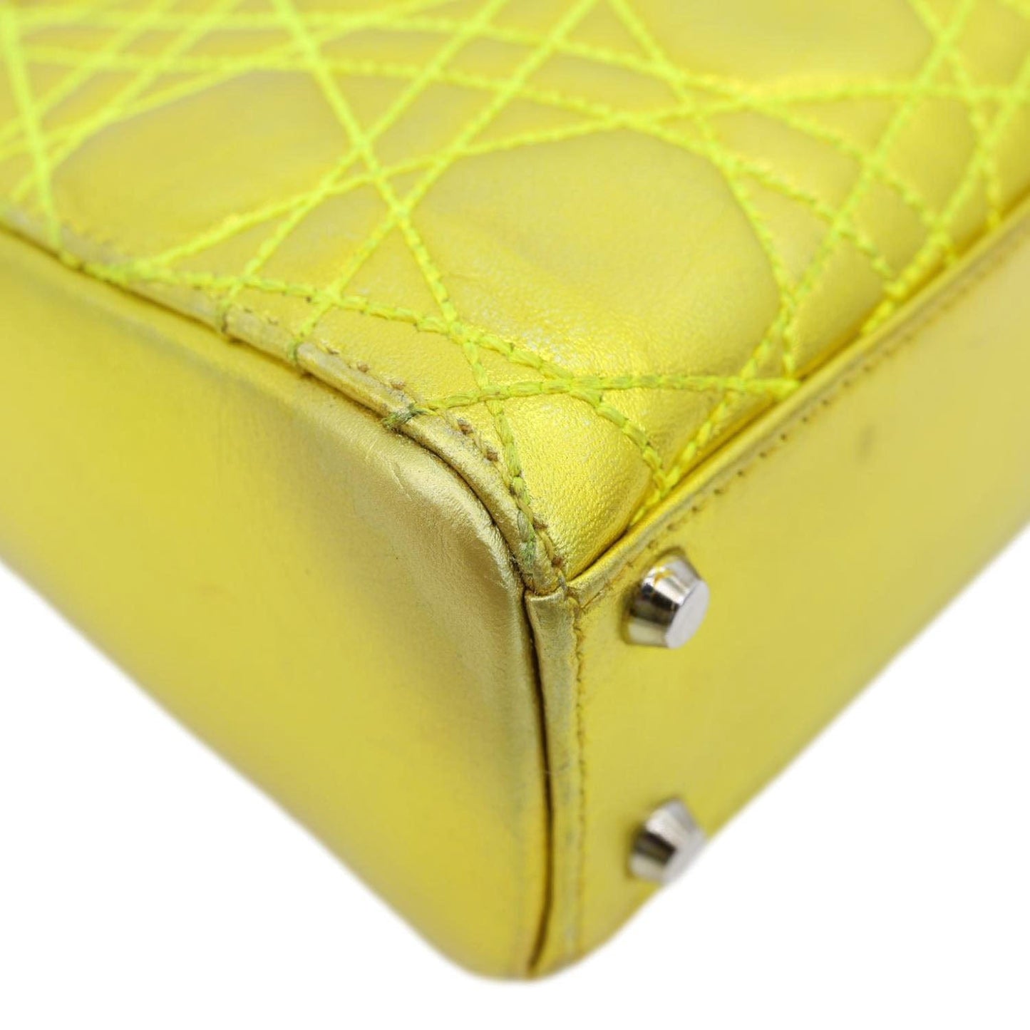 Close-up of a CHRISTIAN DIOR Lady Dior Mini Metallic Leather Shoulder Bag Neon Yellow, showing Cannage stitching detail.