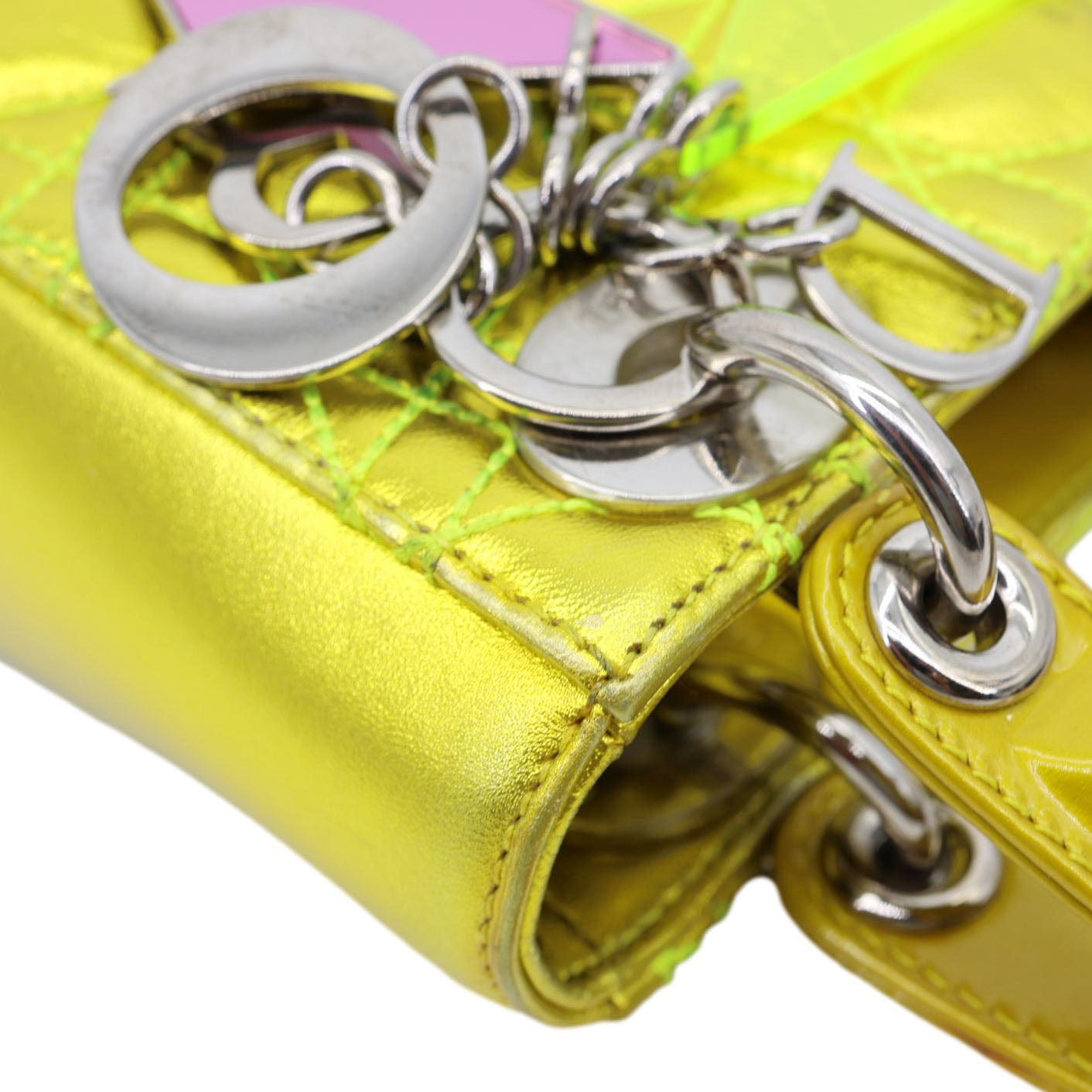 Close-up of CHRISTIAN DIOR Lady Dior Mini Metallic Leather Shoulder Bag Neon Yellow with signature charms and stitching