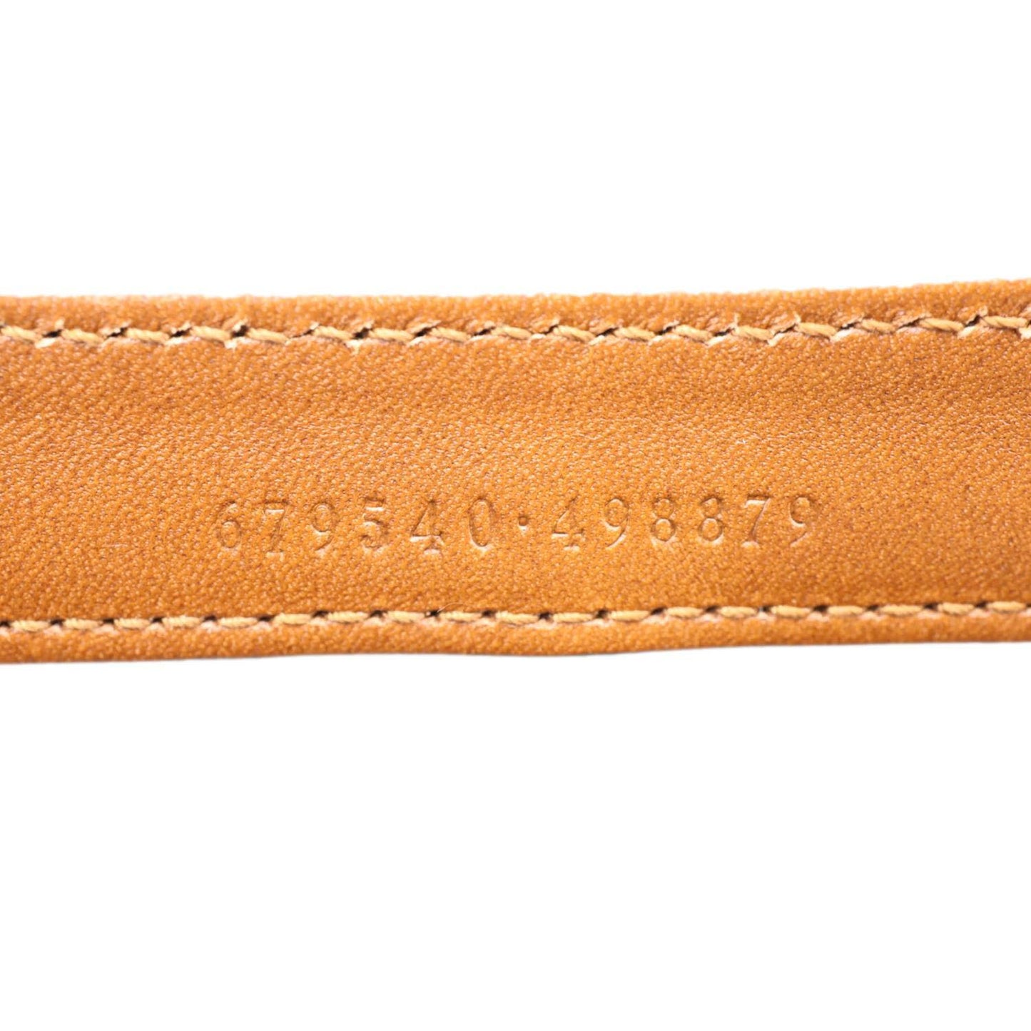 Serial number detail on GUCCI Logo Small Embossed Calfskin Leather Shoulder Bag Brown 679540 with visible stitching.