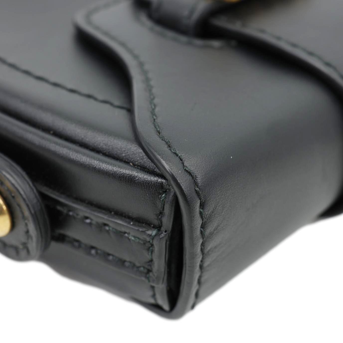 Close-up of CHRISTIAN DIOR D Fence Small Calfskin Leather Saddle Bag Black showing smooth leather detail and signature craftsmanship.