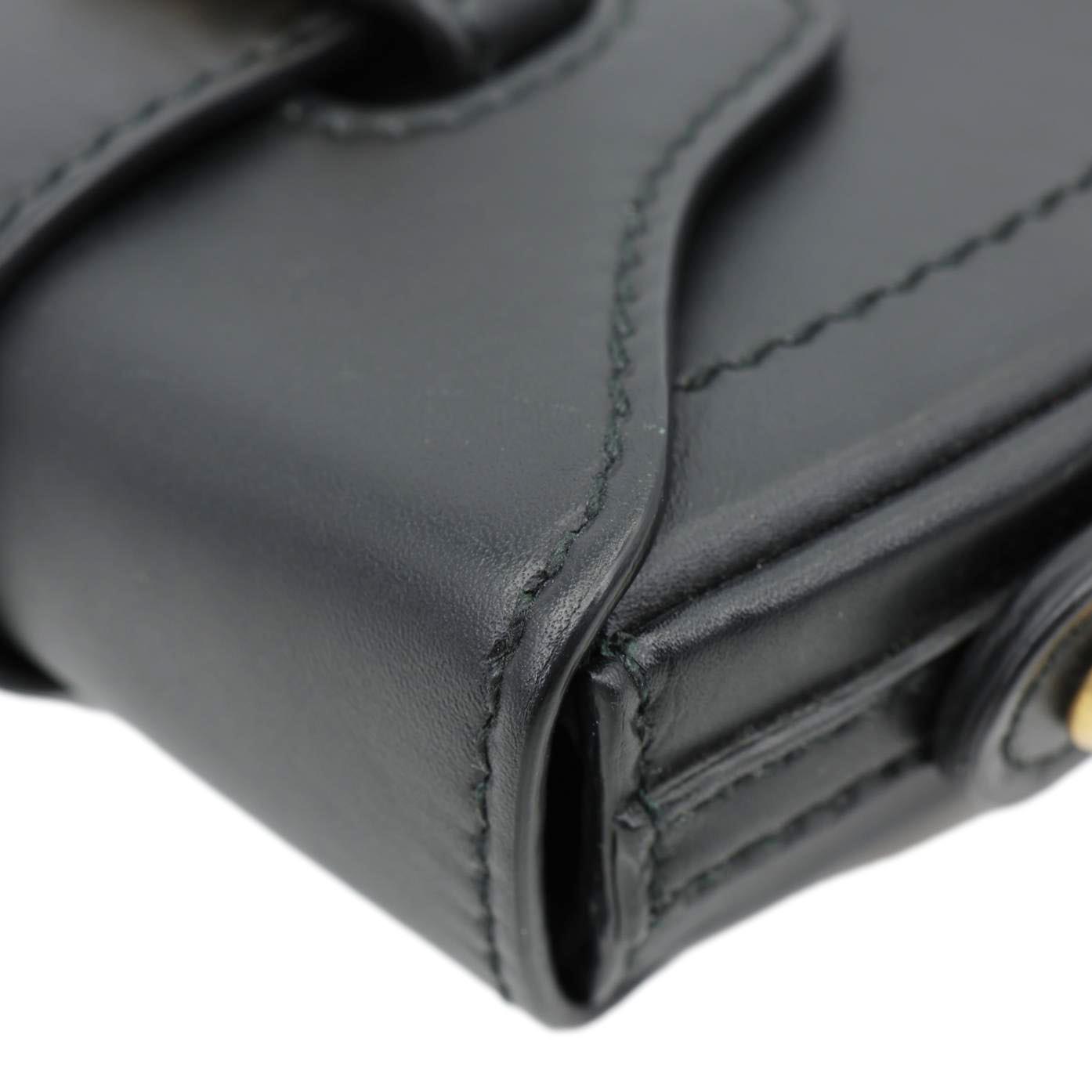Close-up of CHRISTIAN DIOR D Fence Small Calfskin Leather Saddle Bag Black, stylish design in smooth leather with "D" buckle detail.
