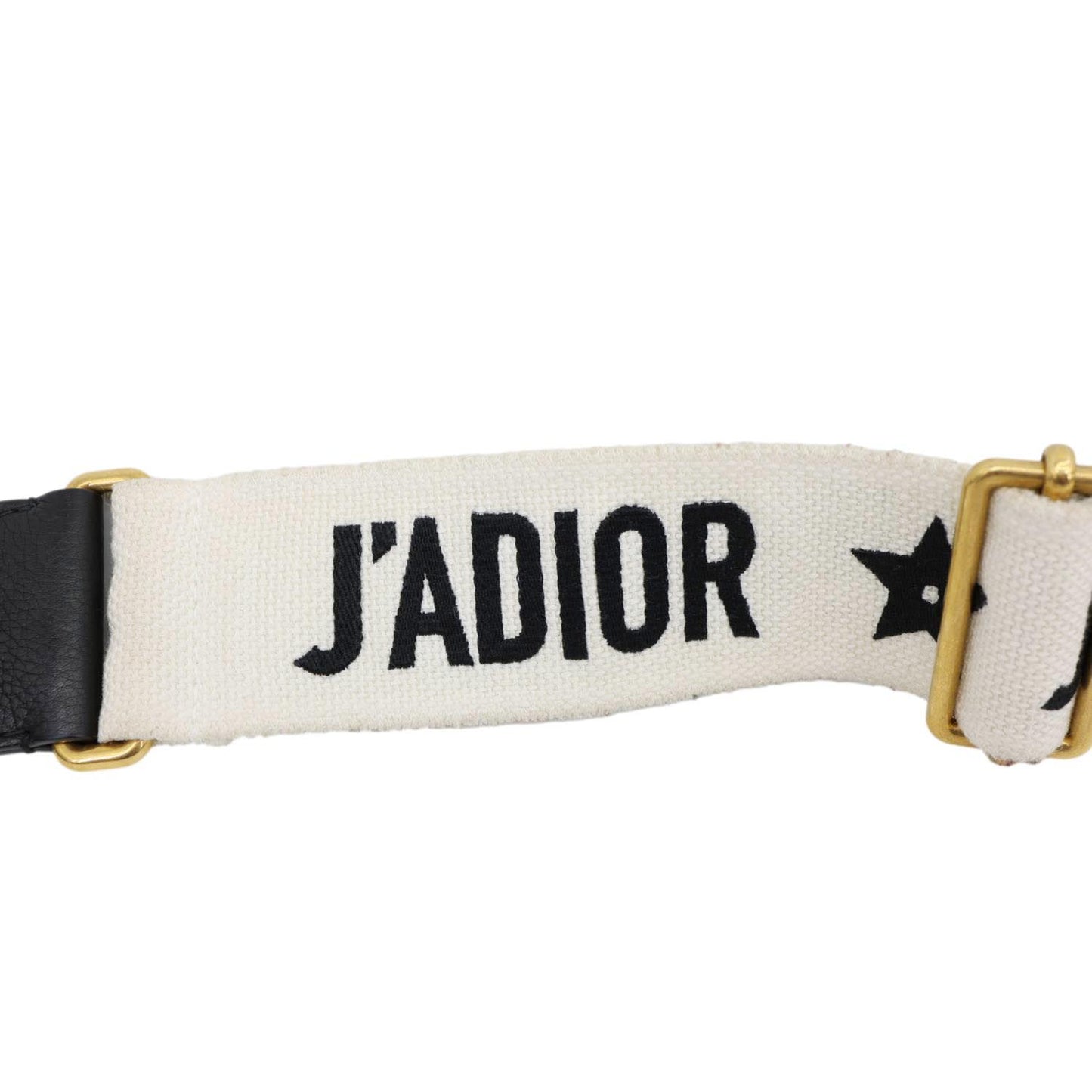 J'ADIOR strap detail of the CHRISTIAN DIOR D Fence Small Calfskin Leather Saddle Bag Black, luxury accessory, modern design.