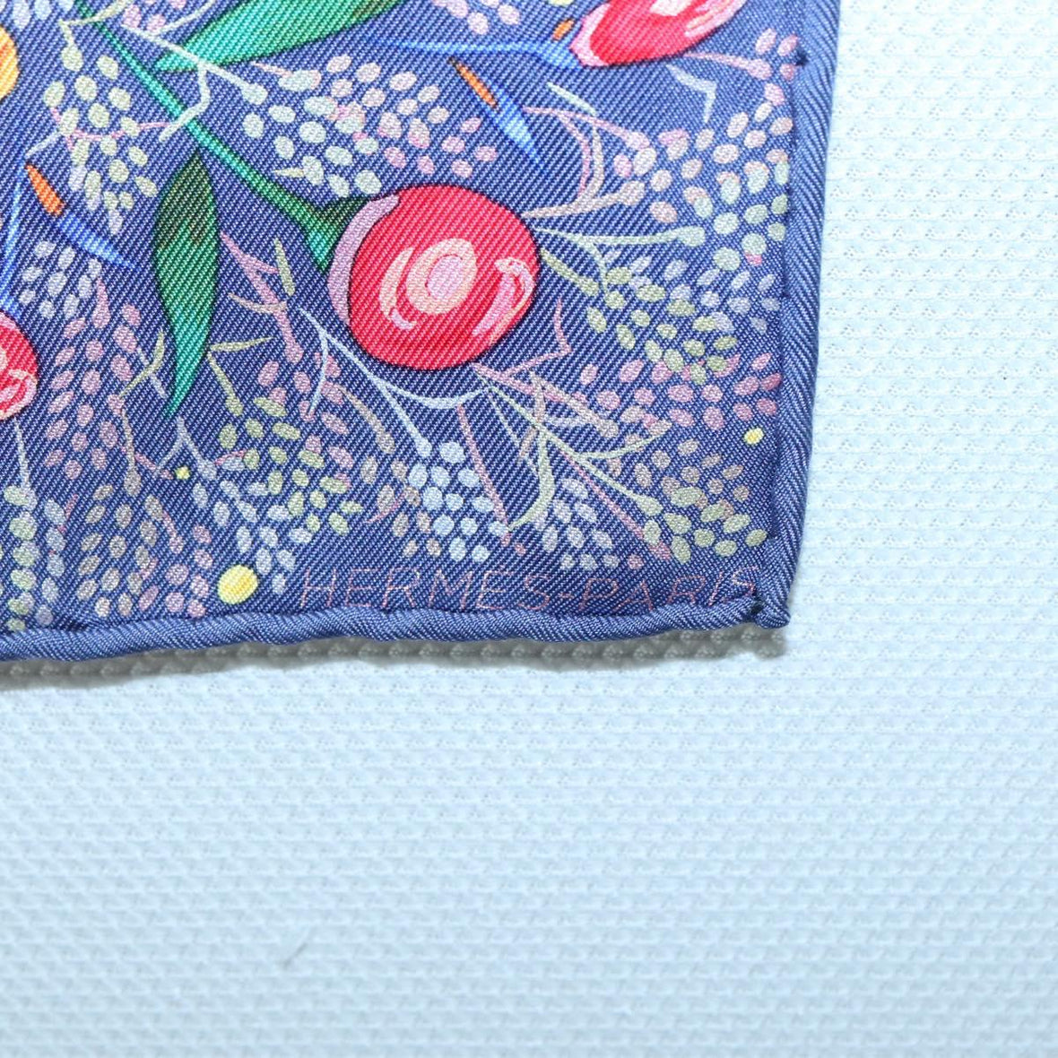 Authentic vintage Hermes silk scarf with floral design, luxury accessory, Hermes logo visible, elegant style, fashion statement piece.