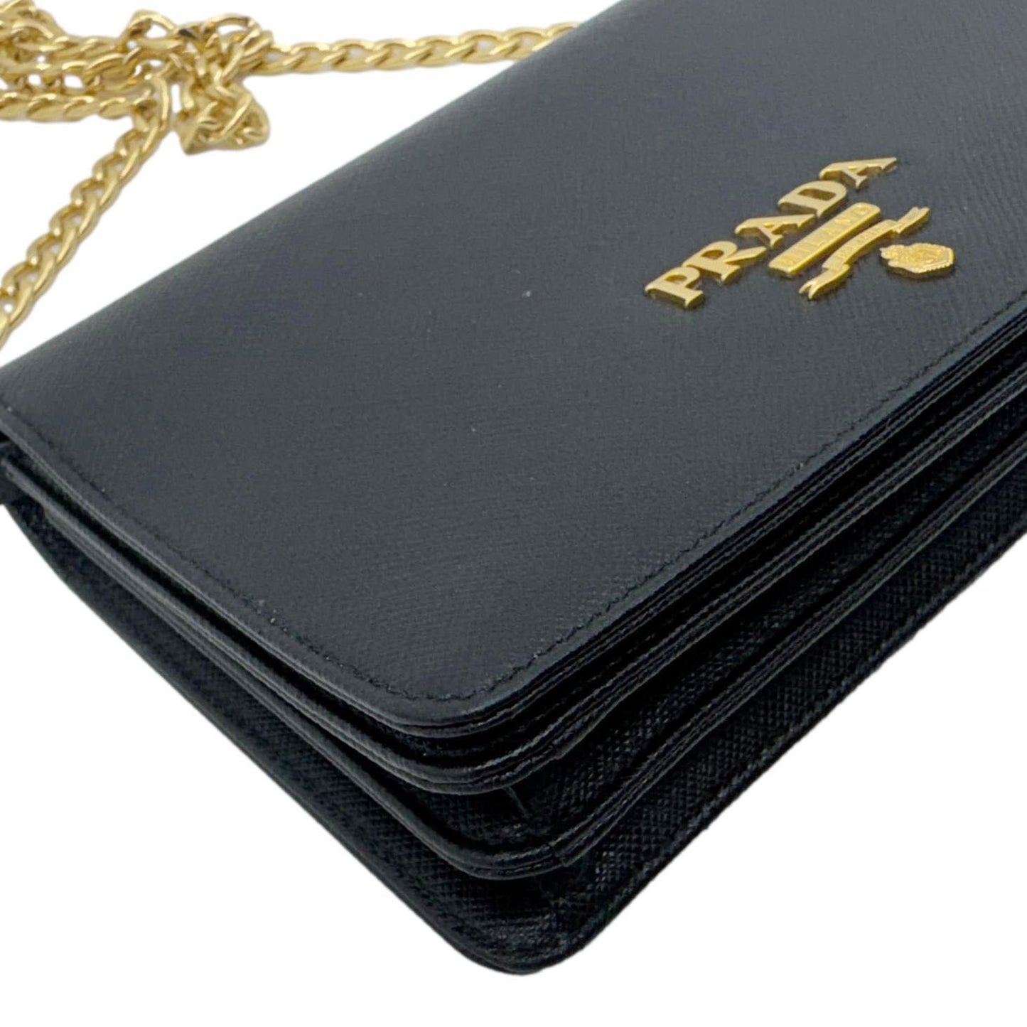 PRADA Saffiano Lux Chain Crossbody Bag Black with gold-tone chain strap and logo detail.