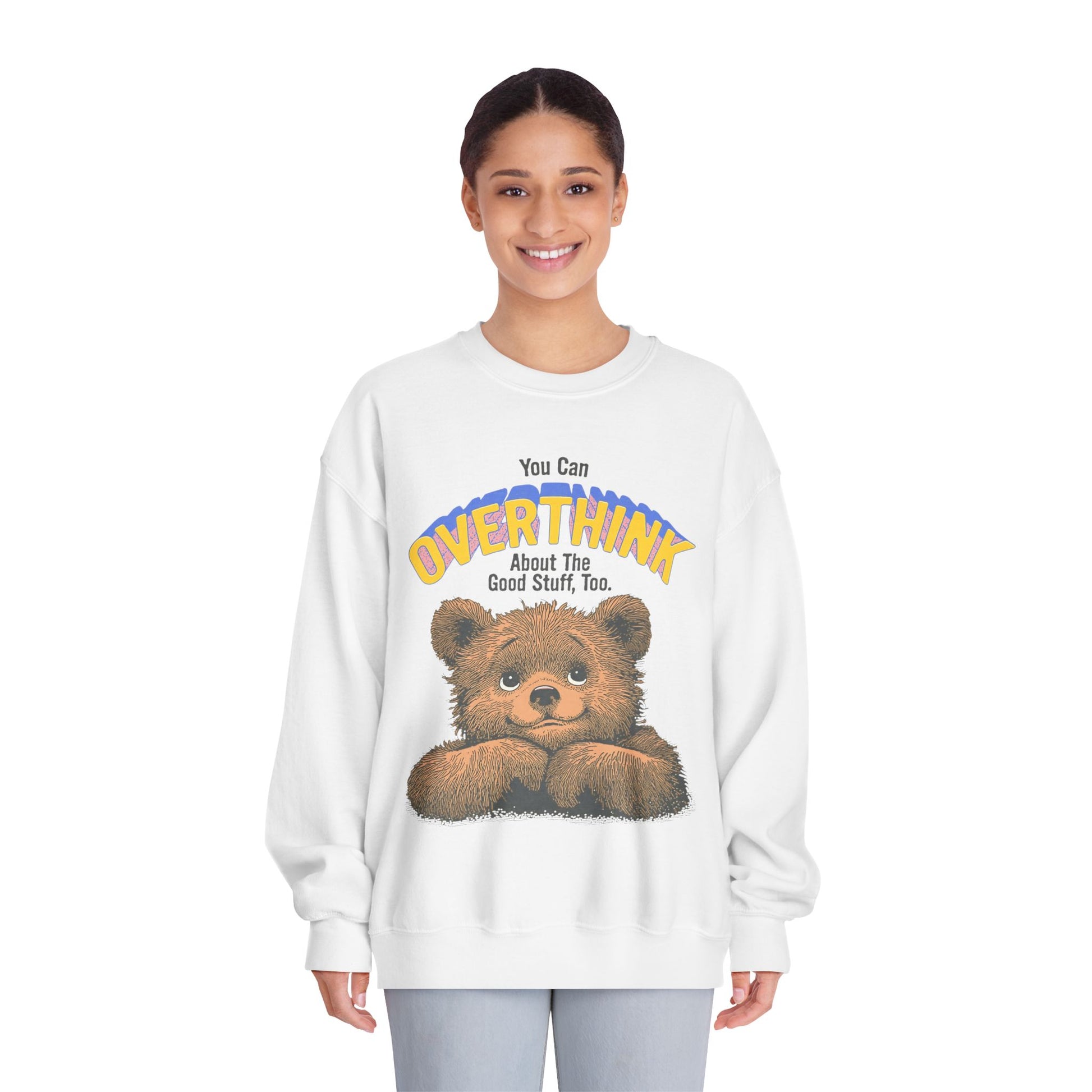 Person wearing a white sweatshirt with a bear graphic and text on a white background