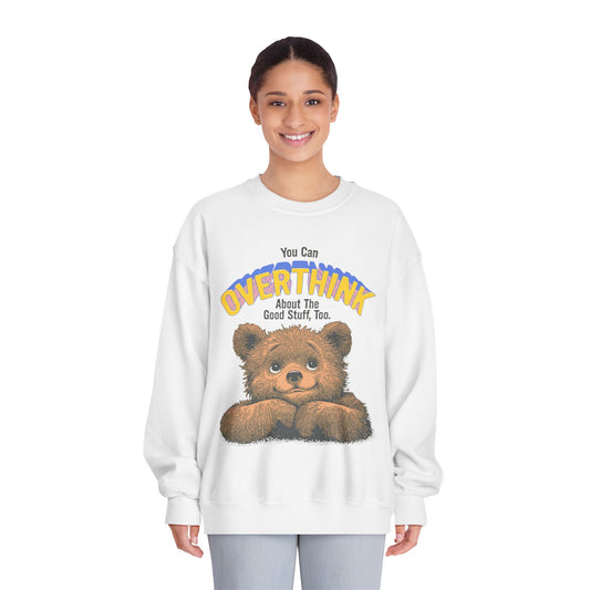 Person wearing a white sweatshirt with a bear graphic and text on a white background