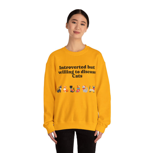 Person wearing a yellow sweatshirt with cat-themed text on a white background