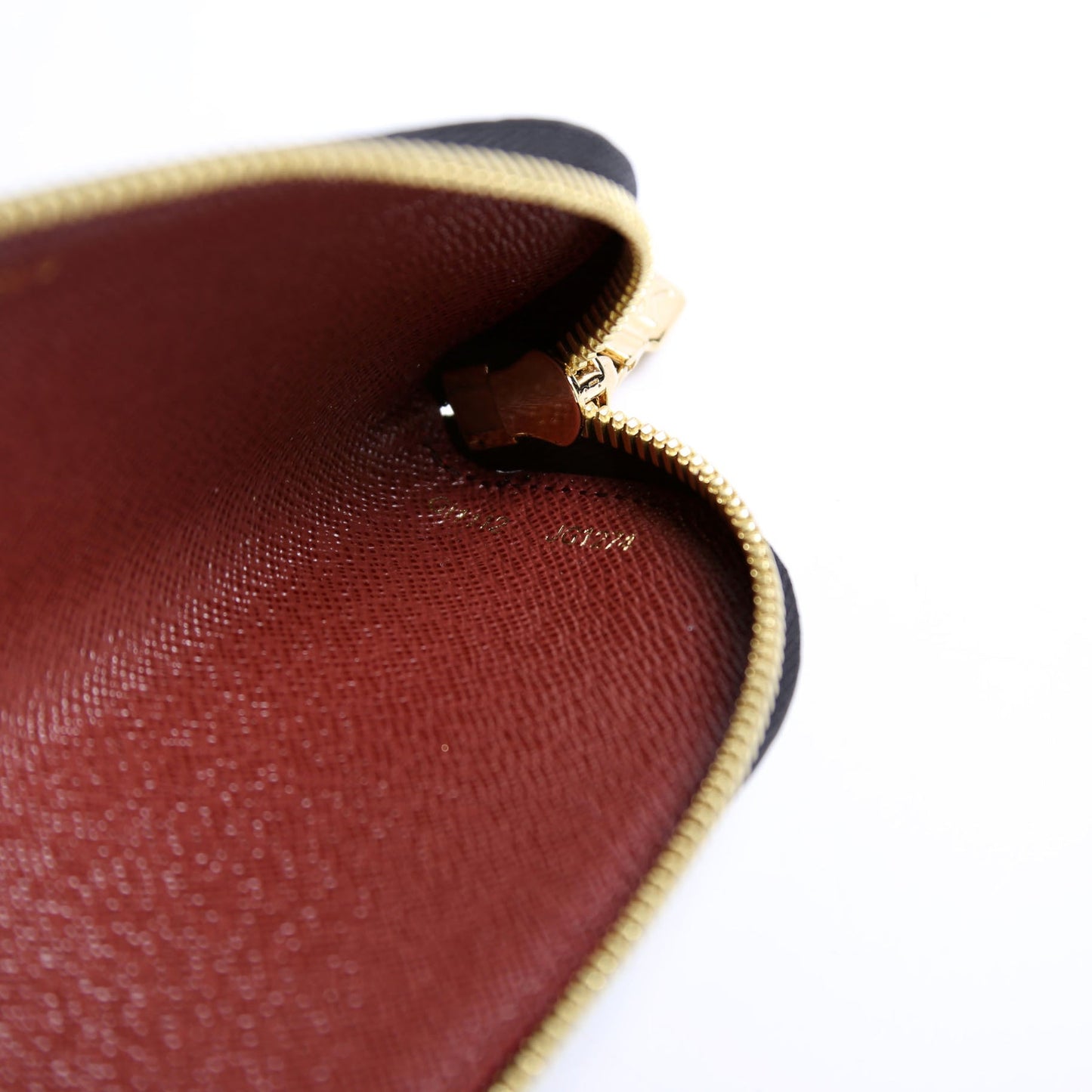 Interior view of the Louis Vuitton Come and Play With Me Charlotte Pencil Pouch Reverse Monogram, showcasing smooth zipper and clean interior.