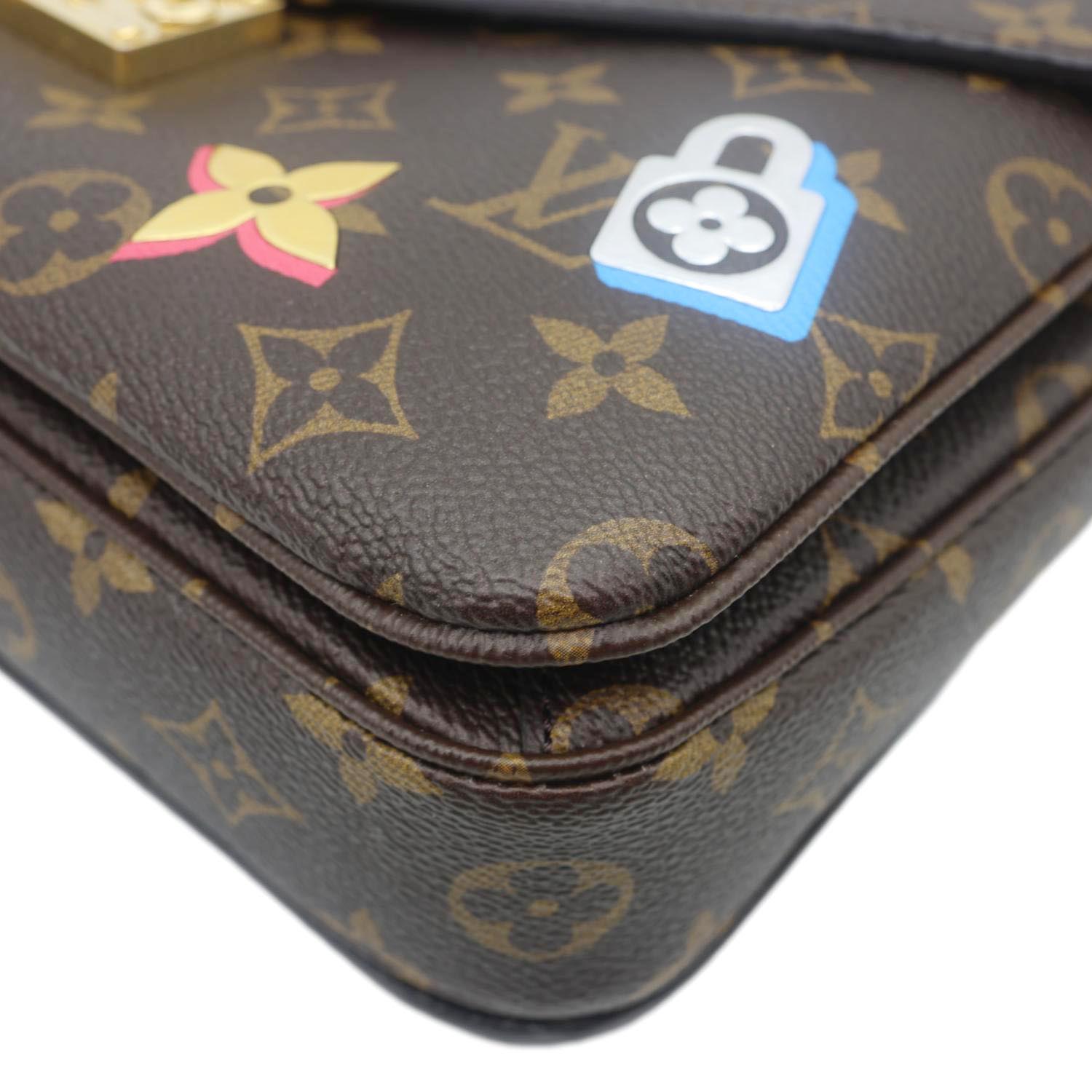 LOUIS VUITTON Lovelock Metis Pochette Patches Monogram Canvas Crossbody Bag Brown with playful patch details close-up.