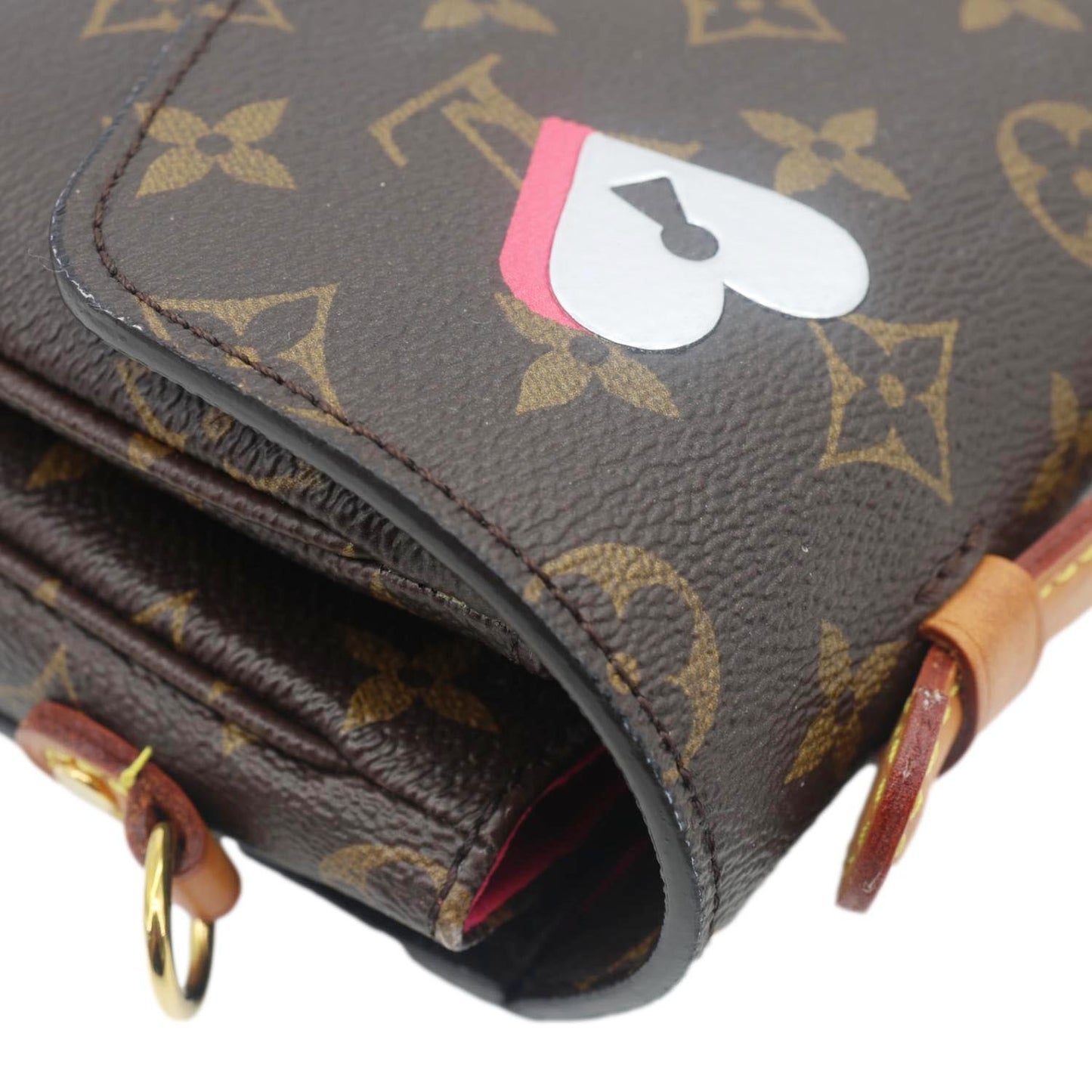 LOUIS VUITTON Lovelock Metis Pochette Patches Monogram Canvas Crossbody Bag Brown corner detail with heart and spade patch