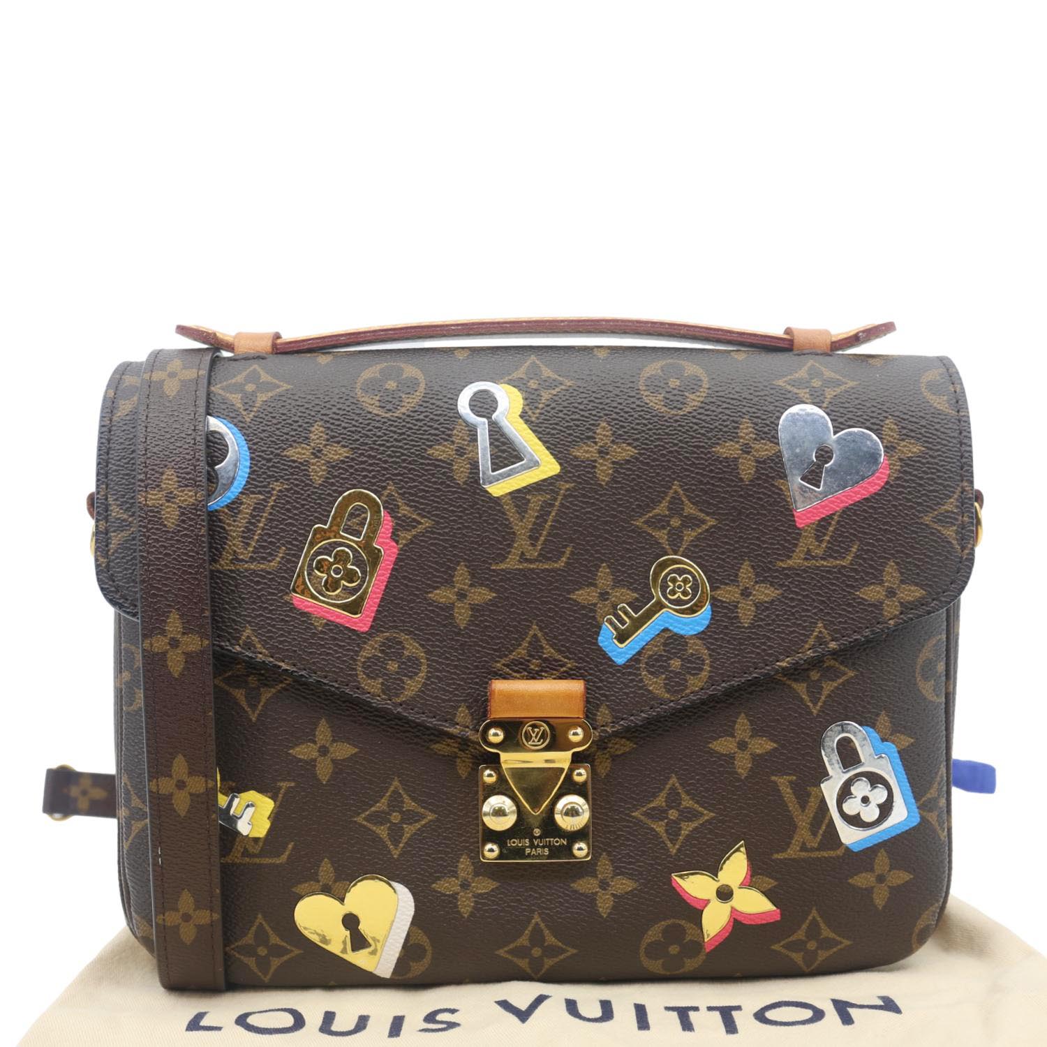 LOUIS VUITTON Lovelock Metis Pochette Patches Monogram Canvas Crossbody Bag Brown with playful patch details on dust bag.
