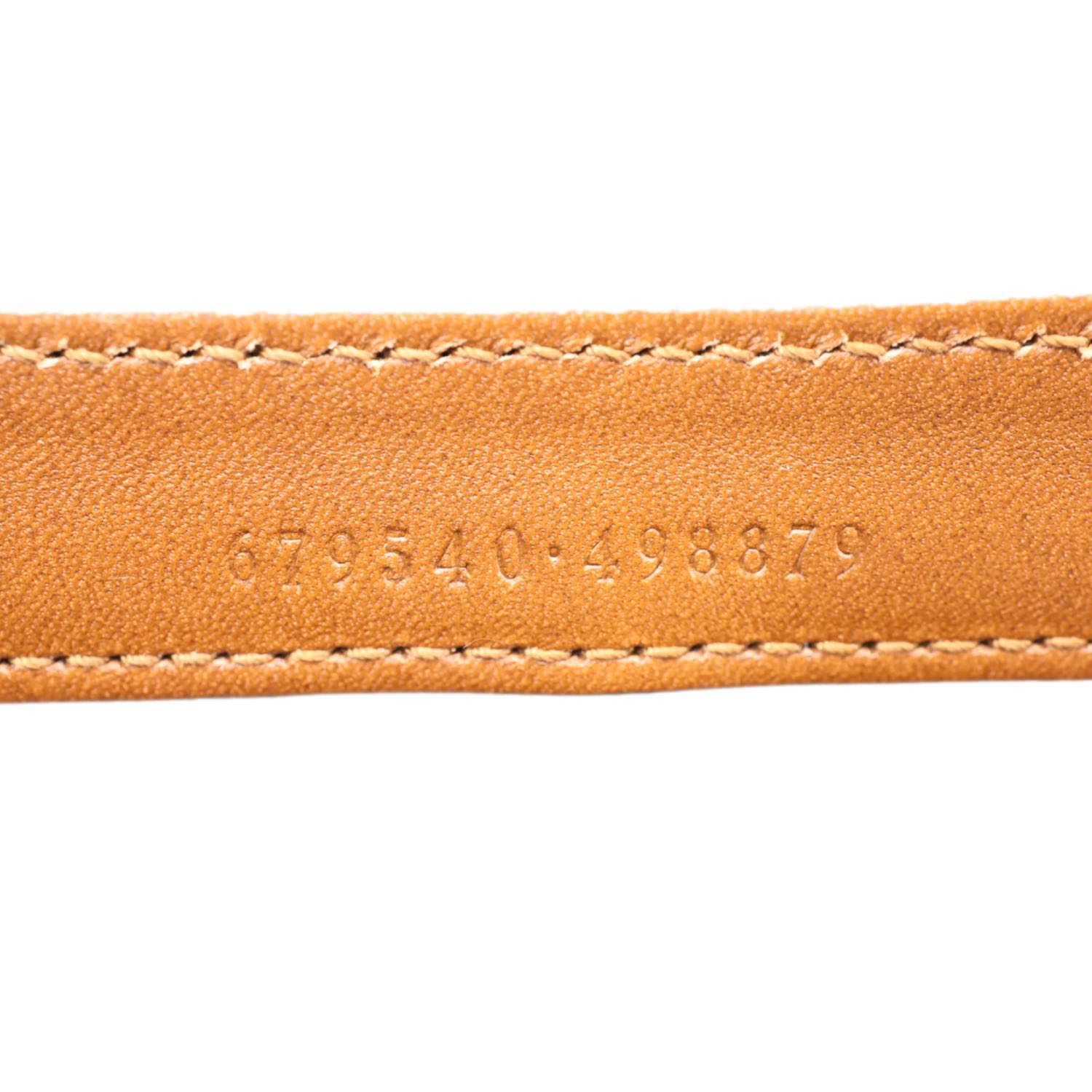 Serial number detail on GUCCI Logo Small Embossed Calfskin Leather Shoulder Bag Brown 679540 with visible stitching.