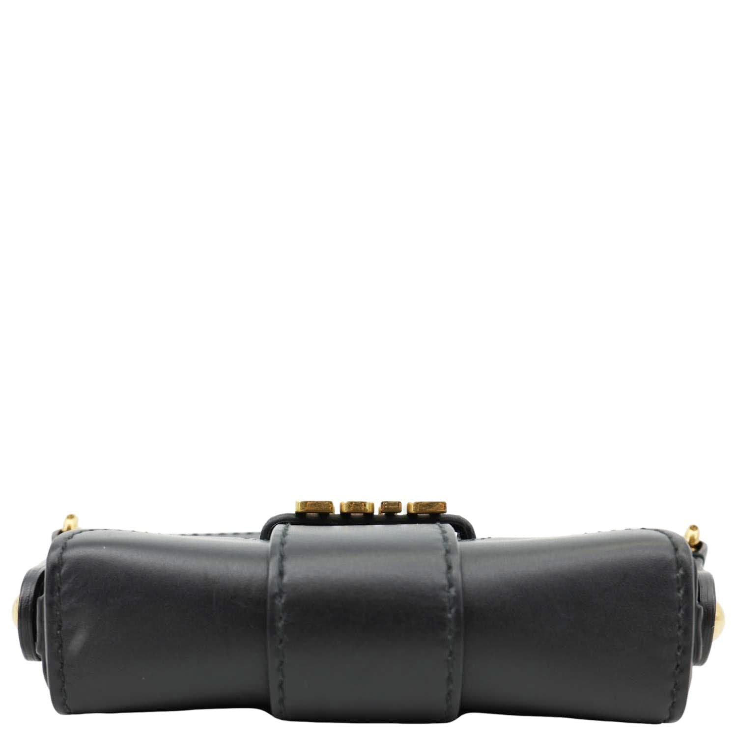 CHRISTIAN DIOR D Fence Small Calfskin Leather Saddle Bag Black bottom view with gold details, luxury fashion accessory.