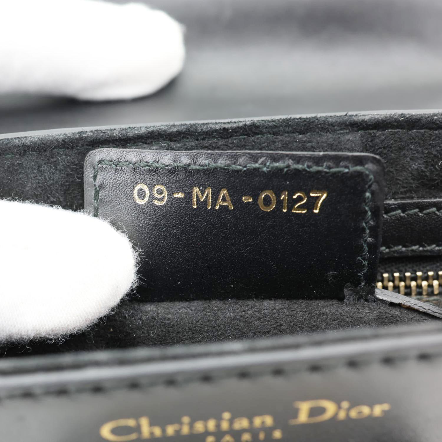 CHRISTIAN DIOR D Fence Small Calfskin Leather Saddle Bag Black inner tag detailing with serial number.