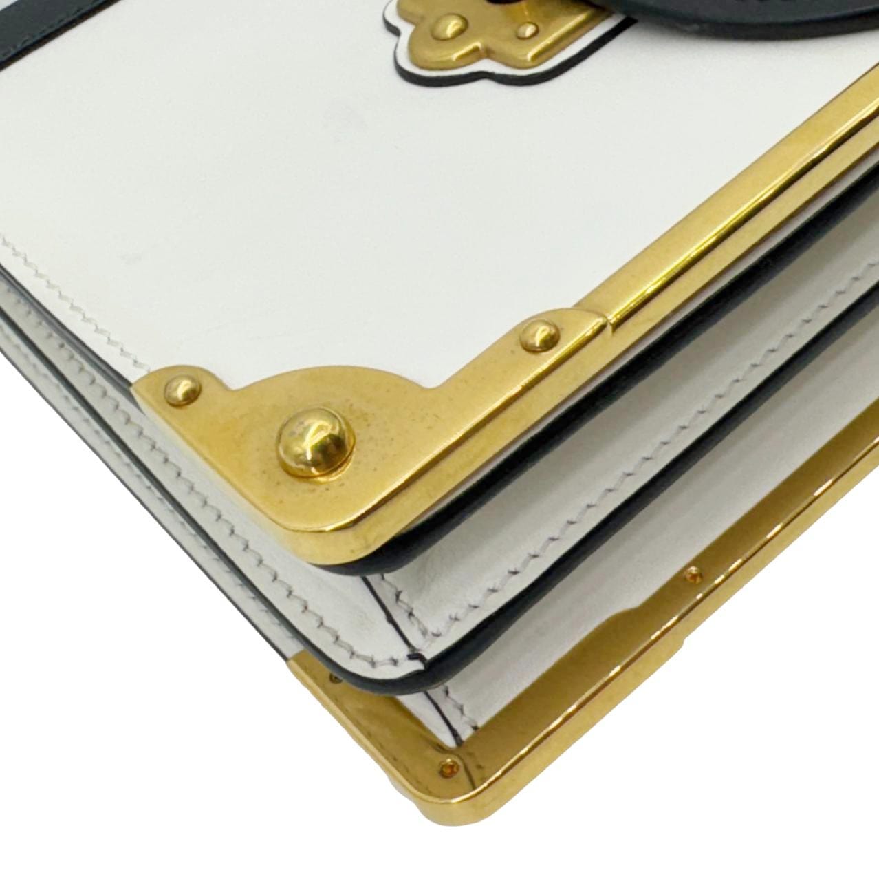 Close-up of PRADA Cahier City Large Calf Saffiano Leather Shoulder Bag White with gold-tone hardware and book-inspired design.